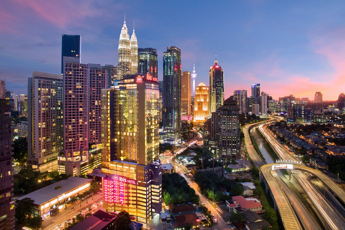 The iconic Petronas Twin Towers standing tall against the Kuala Lumpur skyline