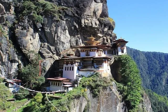 Tawang Monastery atop a hill, surrounded by snow-capped peaks