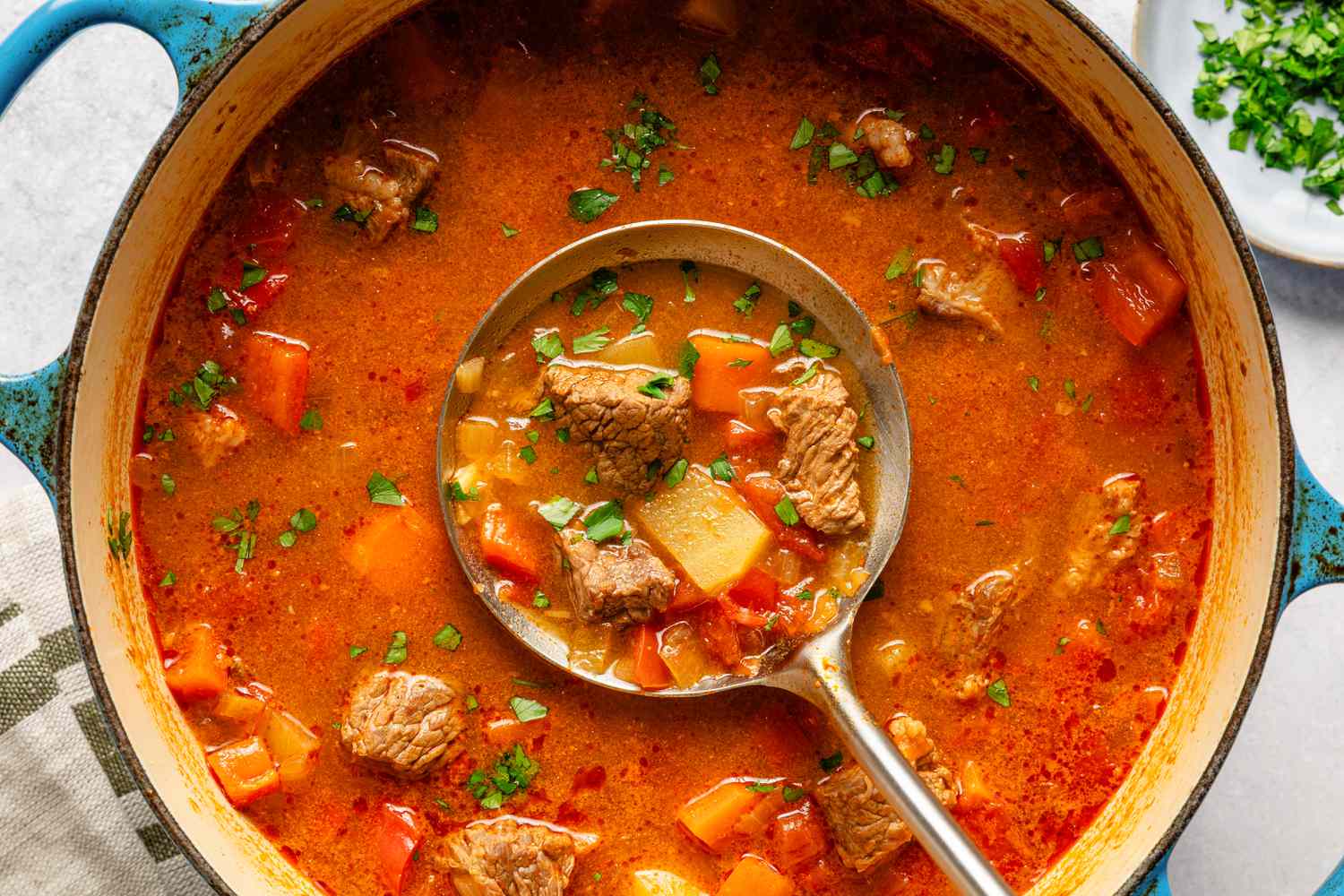 Classic Hungarian Goulash with crusty bread on the side 